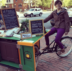 Photo of Laurel Valchuis on her delivery tricycle